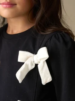 Angel & Rocket Black Eliza Asymmetric Bow Long Sleeves Top